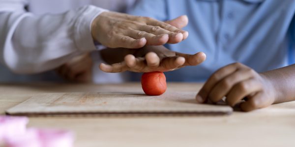 boy-doing-occupational-therapy-session-with-psychologist